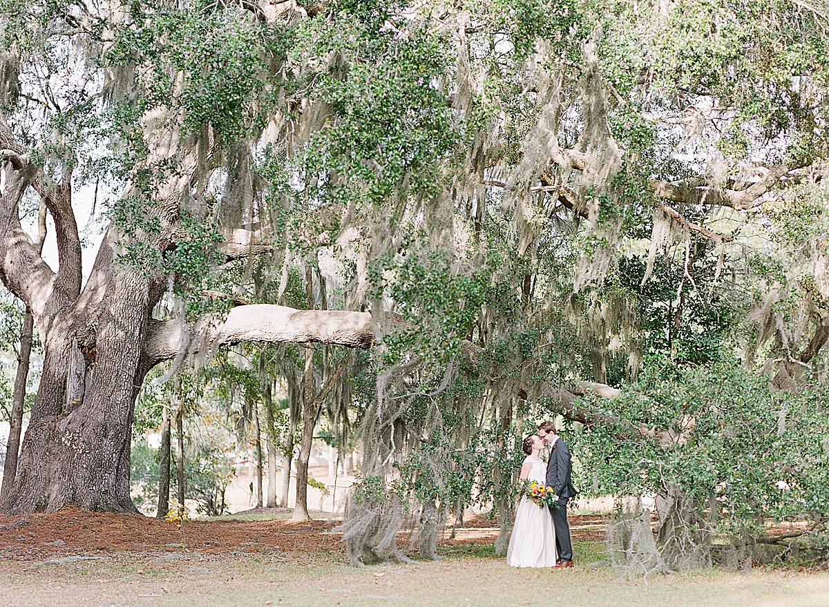 Bride and Groom Nose to Nose Under Big Oak Tree 