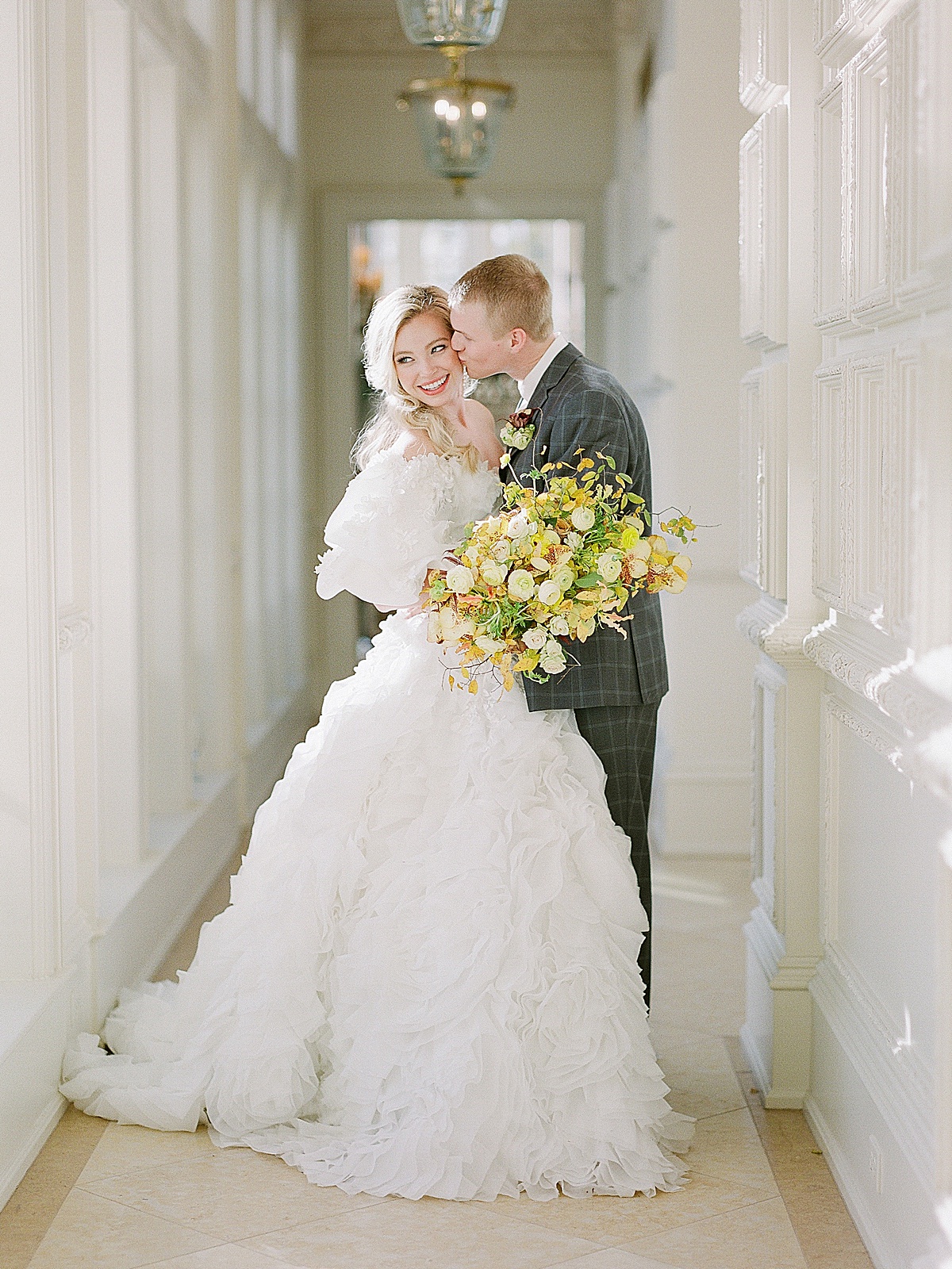 Wedding Venues in Dallas Groom Kissing Bride Smiling Photo