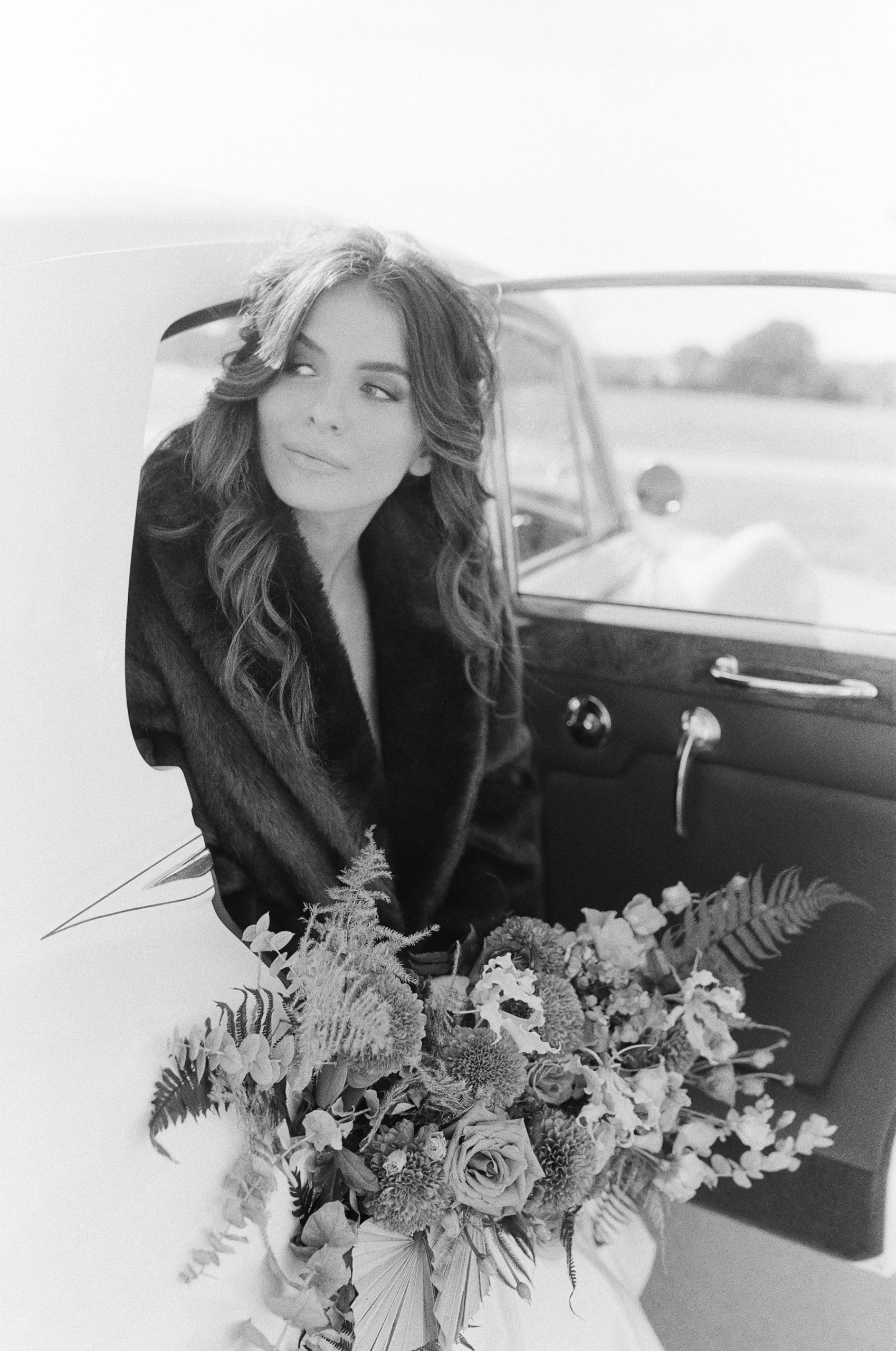 Black and White of Bride in Car 