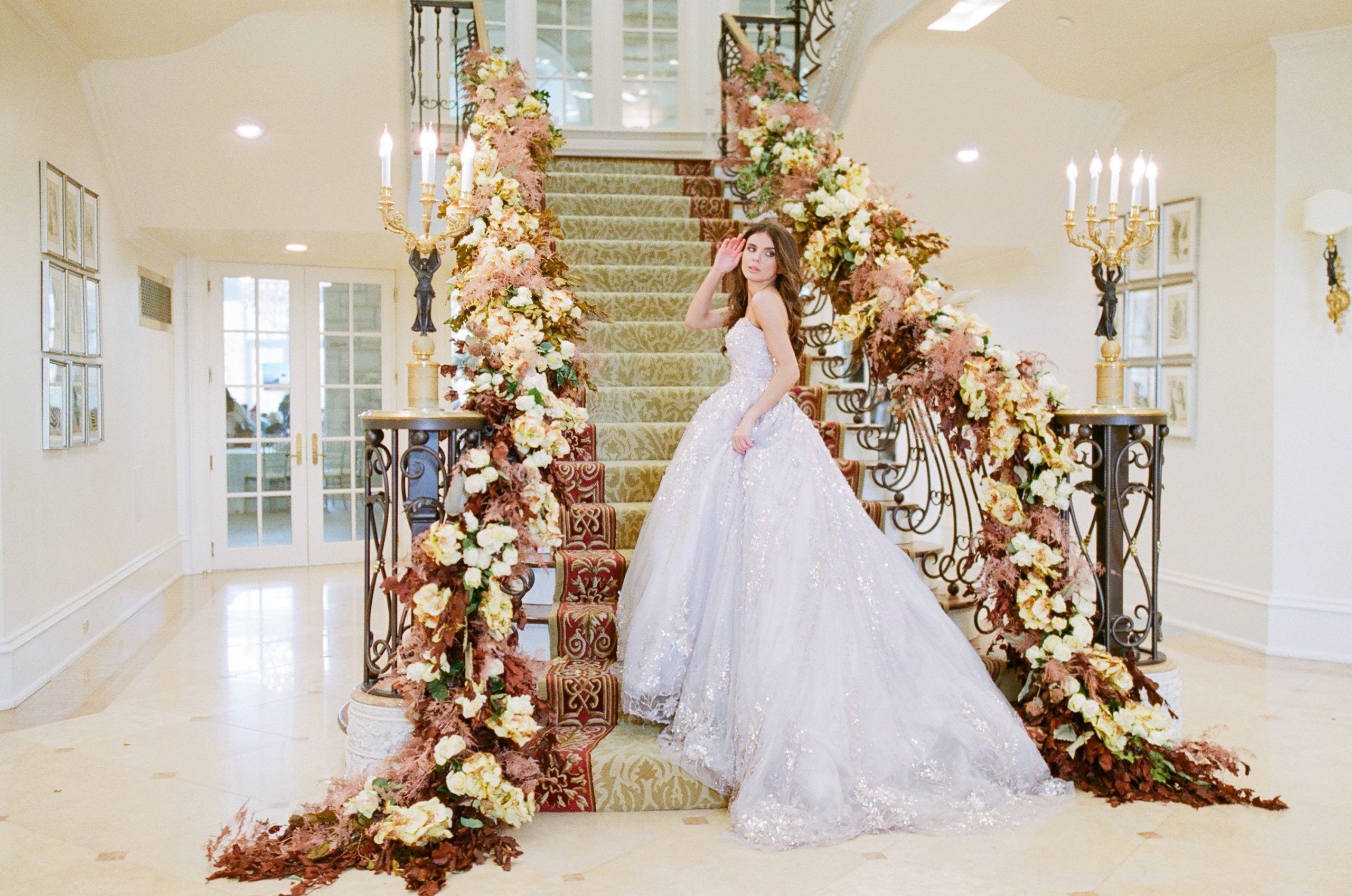 Couture Wedding Dresses Editorial Bride on Grand Staircase Looking Back Photo 