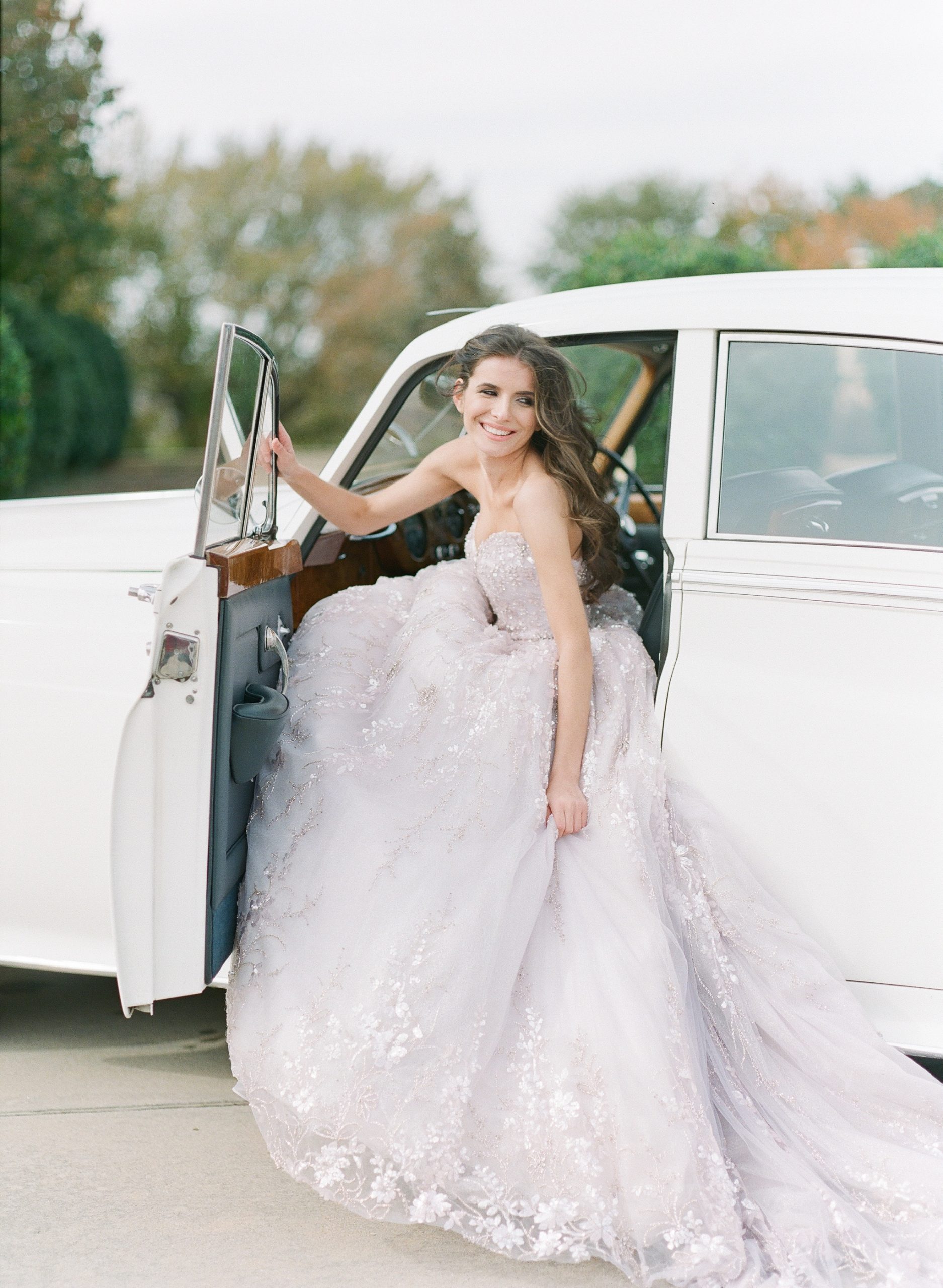 Bride in Lavender Gown sitting in Vintage Rolls Royce Photo 