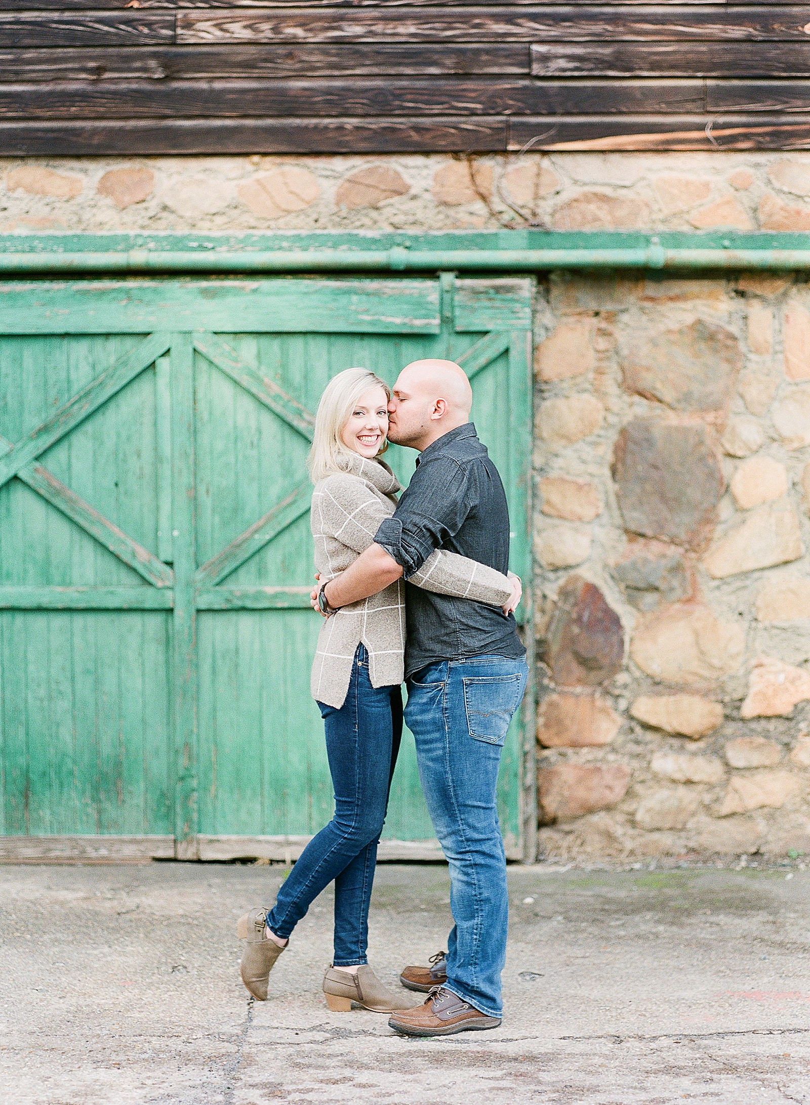 Couple Hugging In Front Of Green Door Photo