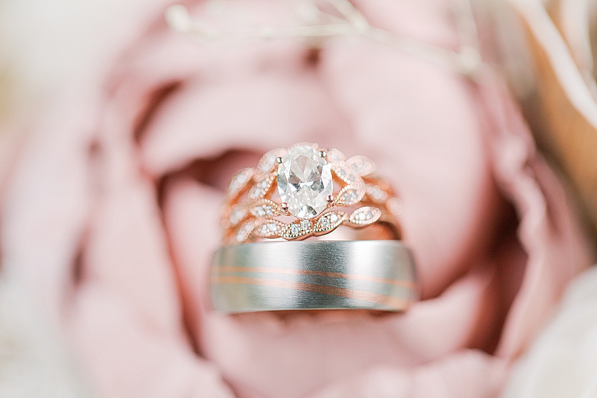 Detail Photog of Wedding Rings on Flower Photo 
