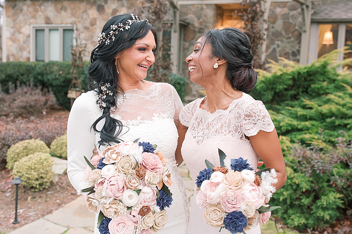Bride and Maid Of Honor Laughing With Each Other Photo 