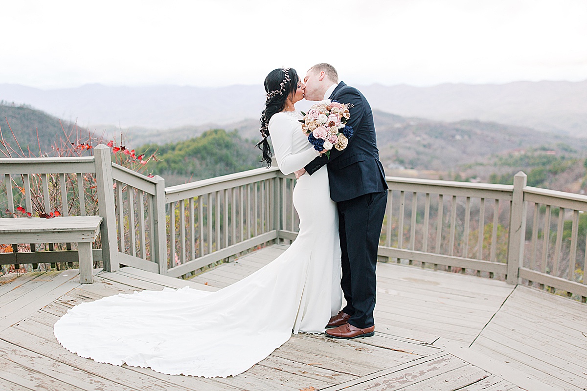 NC Wedding Venue Hawkesdene Couple Kissing At Mountain Overlook Photo
