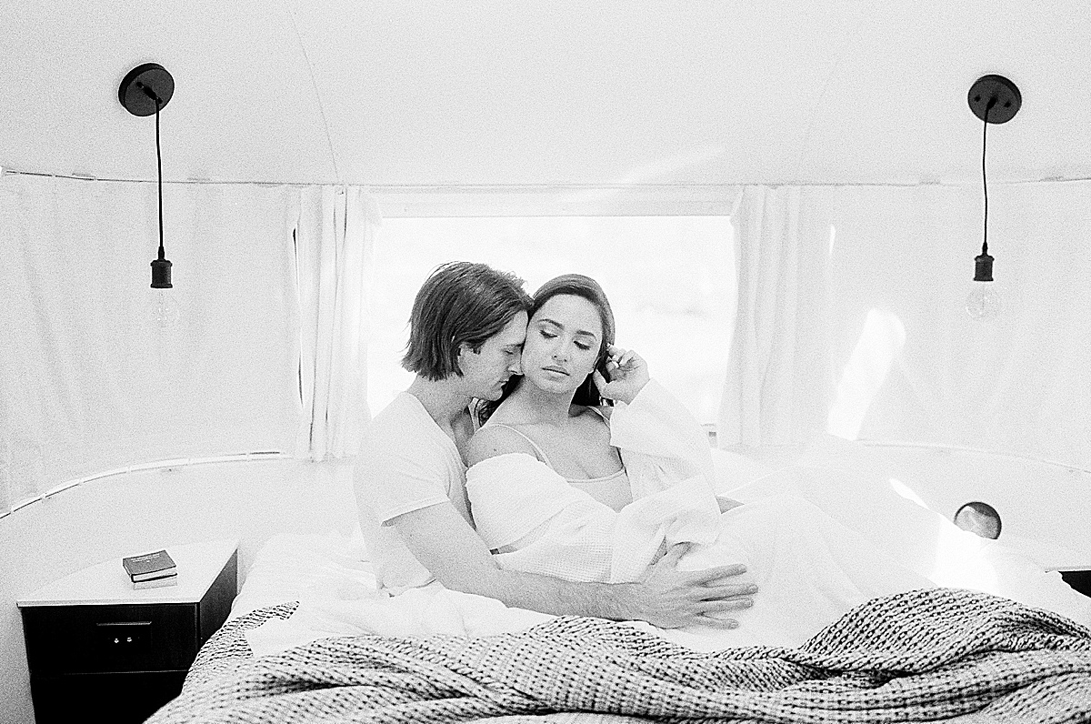 Black And White Of Couple Snuggling In Bed Photo 