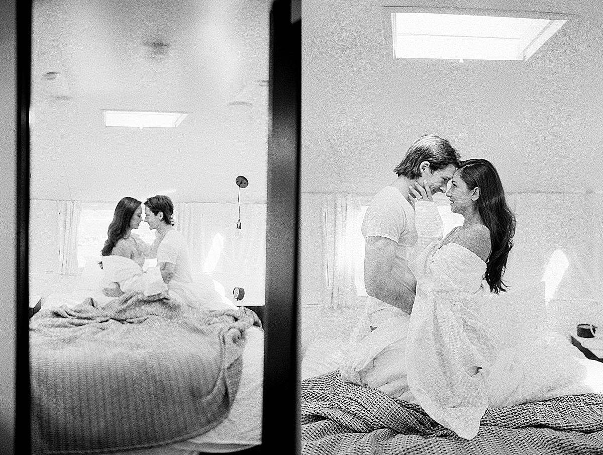 Black and White Of Couple Hugging In Airstream Bed Photos 
