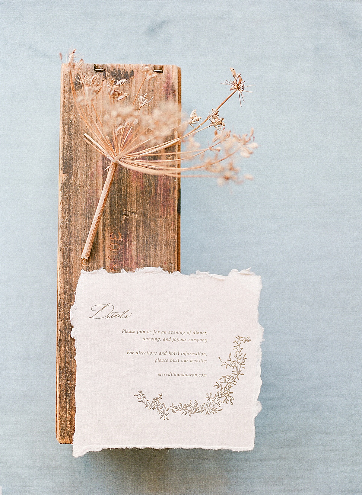 Fine Art Wedding Invitation Details Card on Wood Block with Dried Flowers Photo