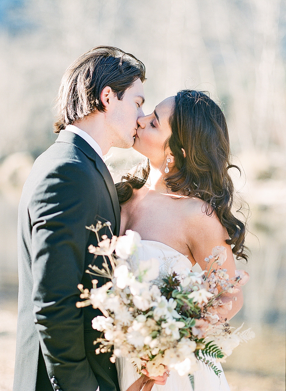 7 Reasons Why We Still Shoot Film Bride and Groom Kissing Photo