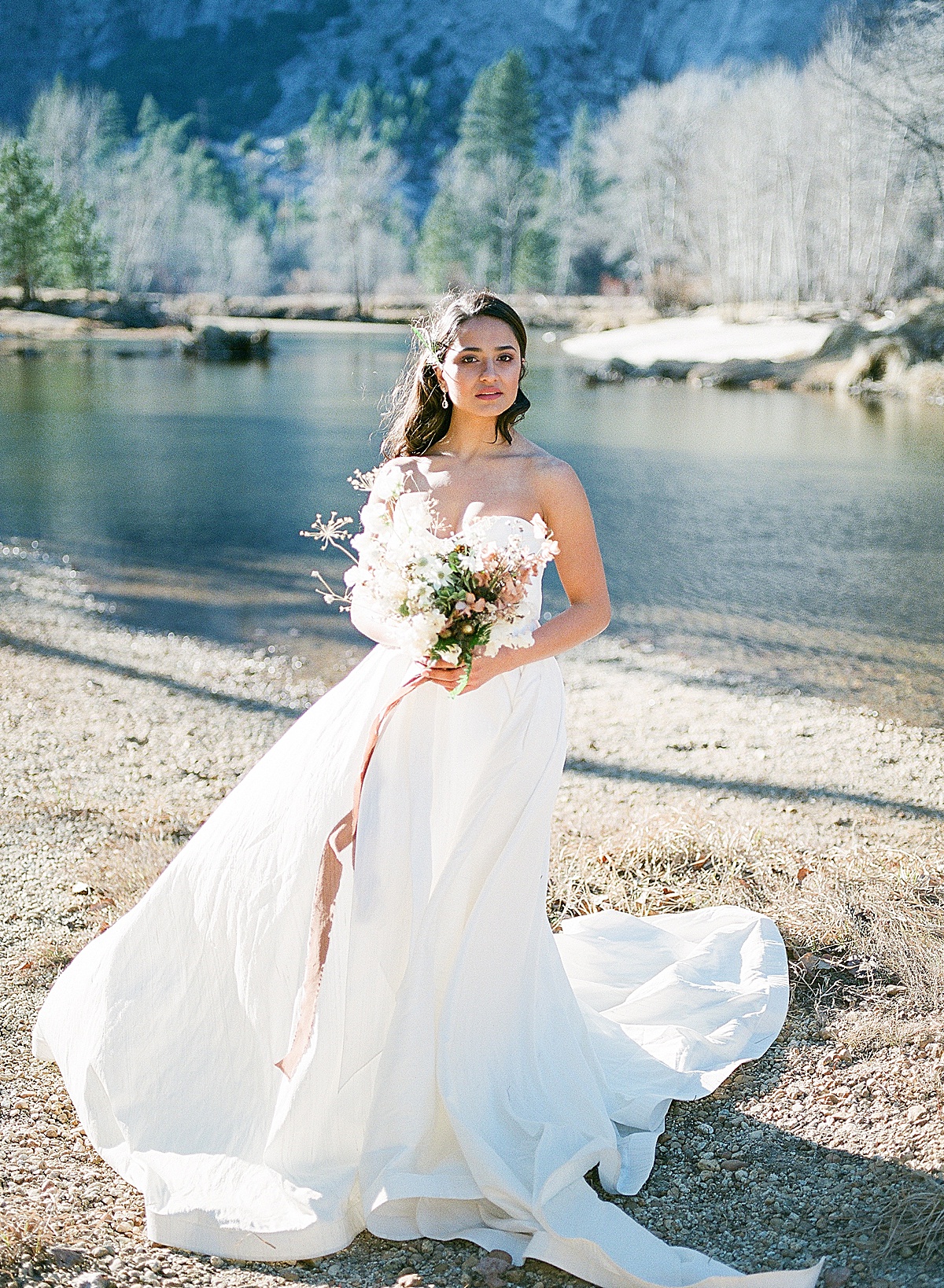 Yosemite Wedding Bride Looking At Camera Holding Bouquet Photos 