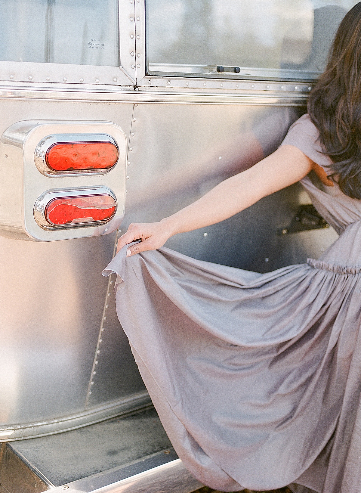 Detail of Model Holding Dress Up Photo 