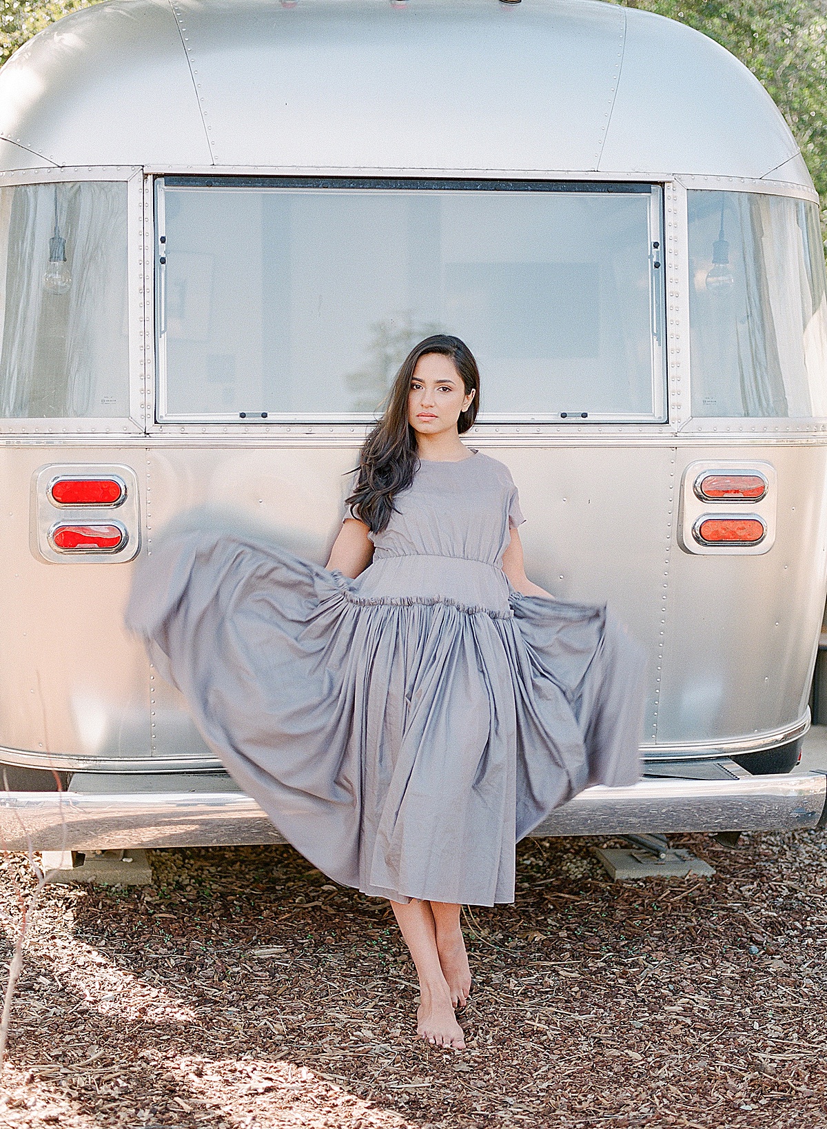 Autocamp Yosemite Avonlea Leaning Against Airstream In Grey Dress Photo