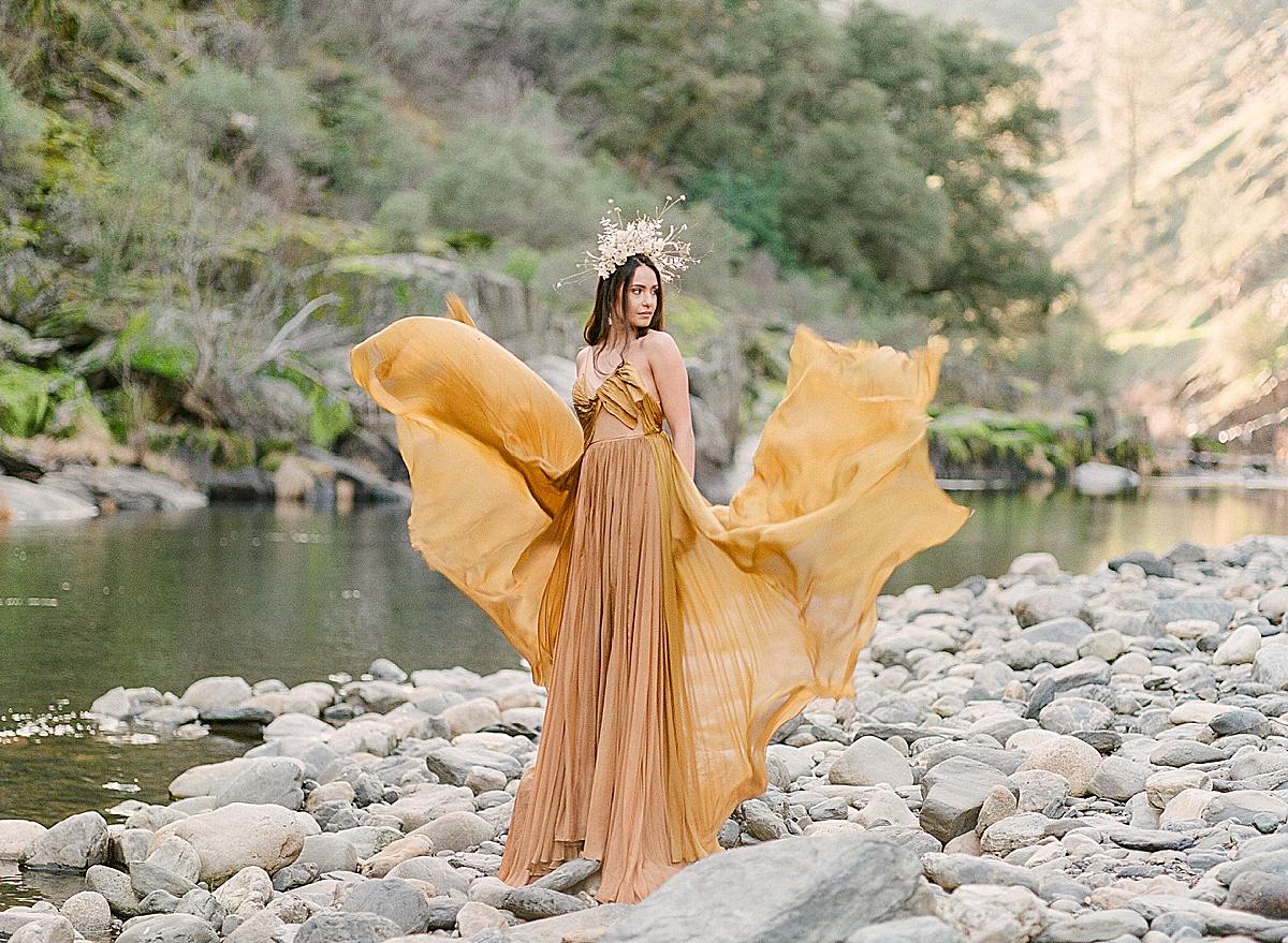Leanne Marshall Golden Gown Model In Flowing Dress On Merced River Photo