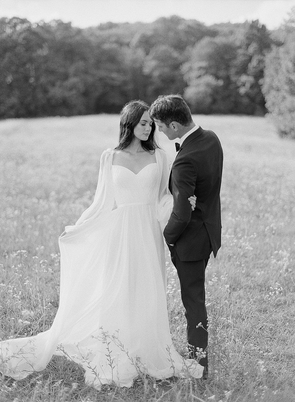 Black and White Photo of Bride and Groom in Field