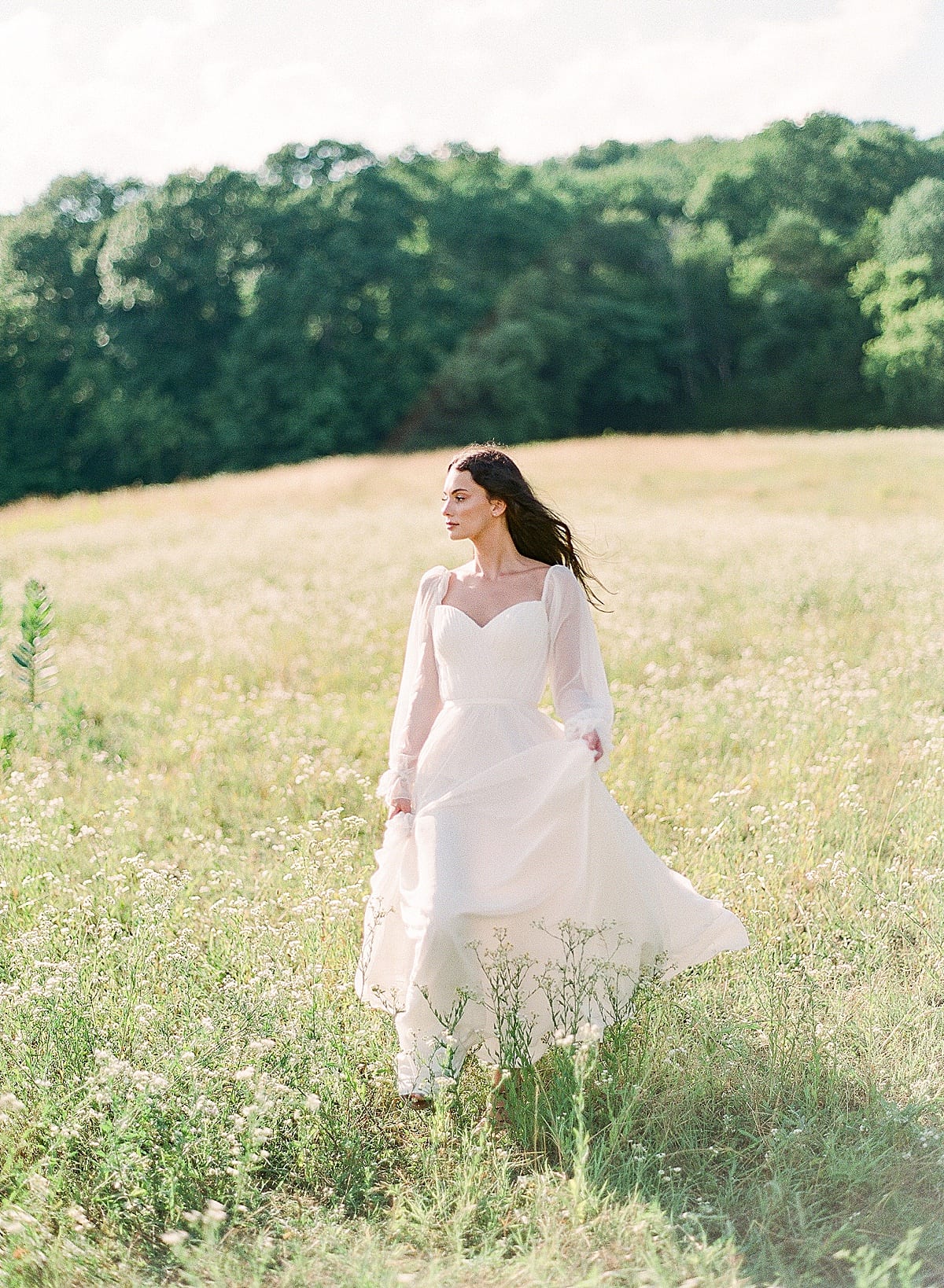 Bride Walking through field photo