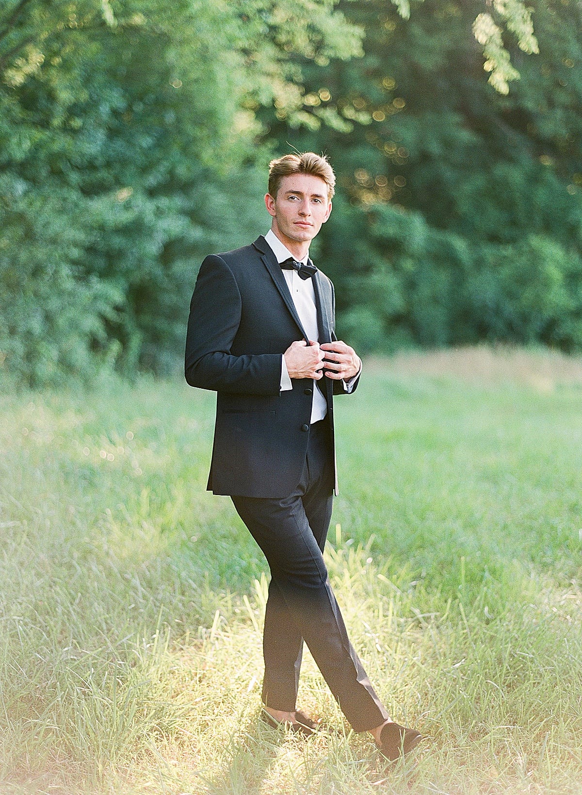Handsome Groom in Black Tux Looking at The Camera Photo 