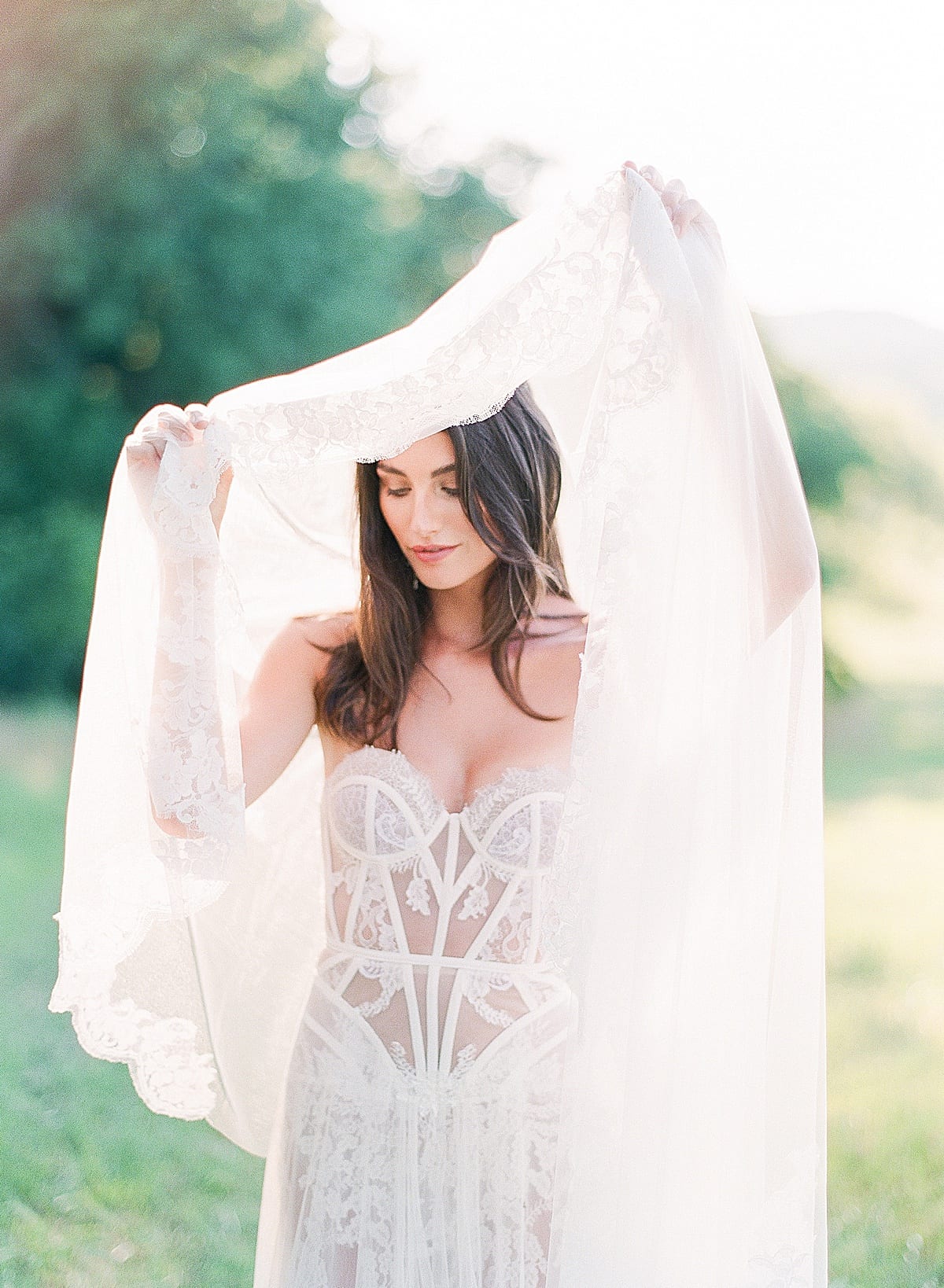 Mint Springs Farm Bride with Veil Over Her Head Looking Down Photo