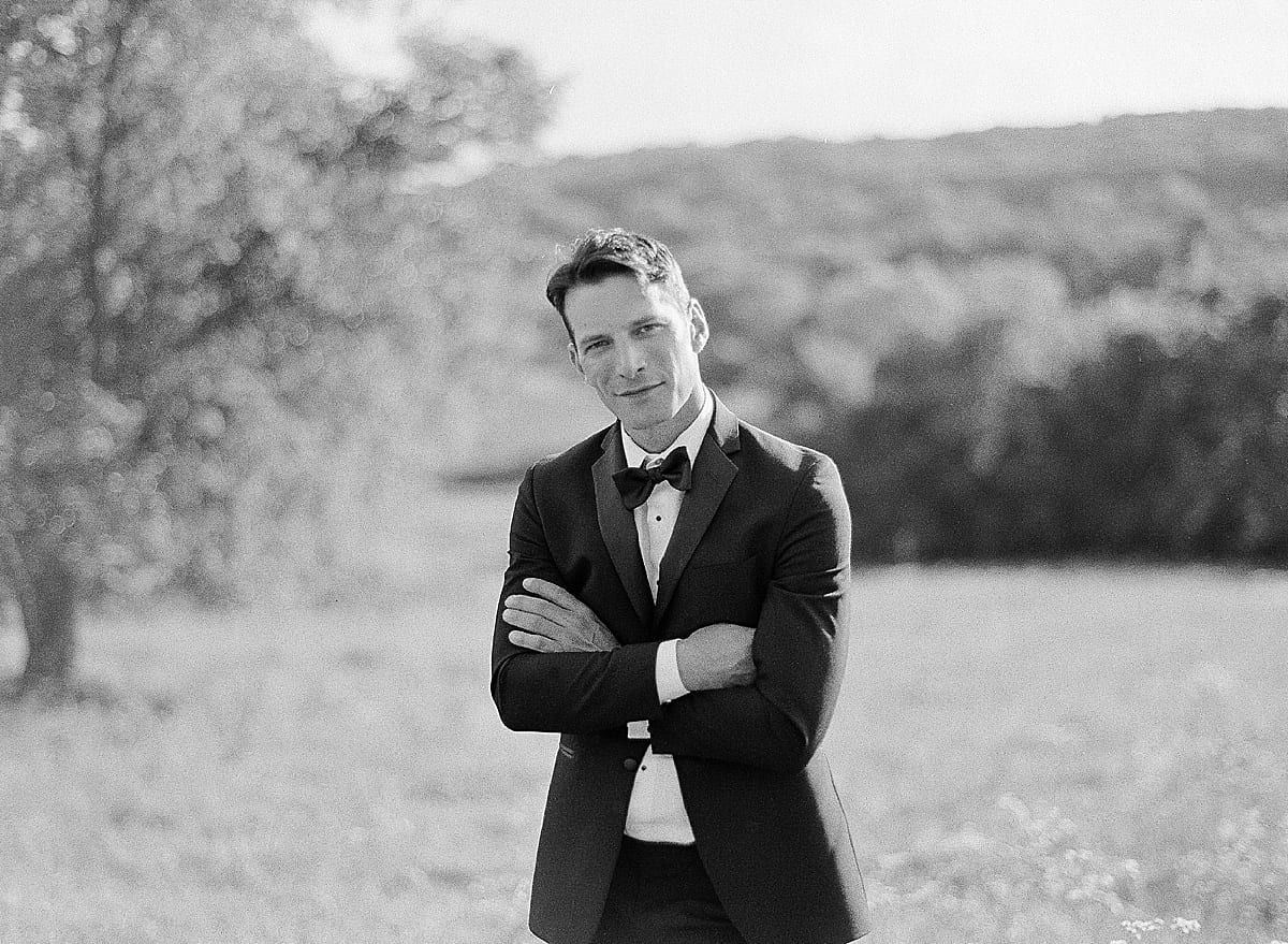 Black and White of Groom with arms Crossed Photo