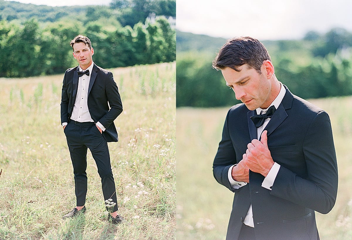 Groom with hands in his pockets and holding jacket photos