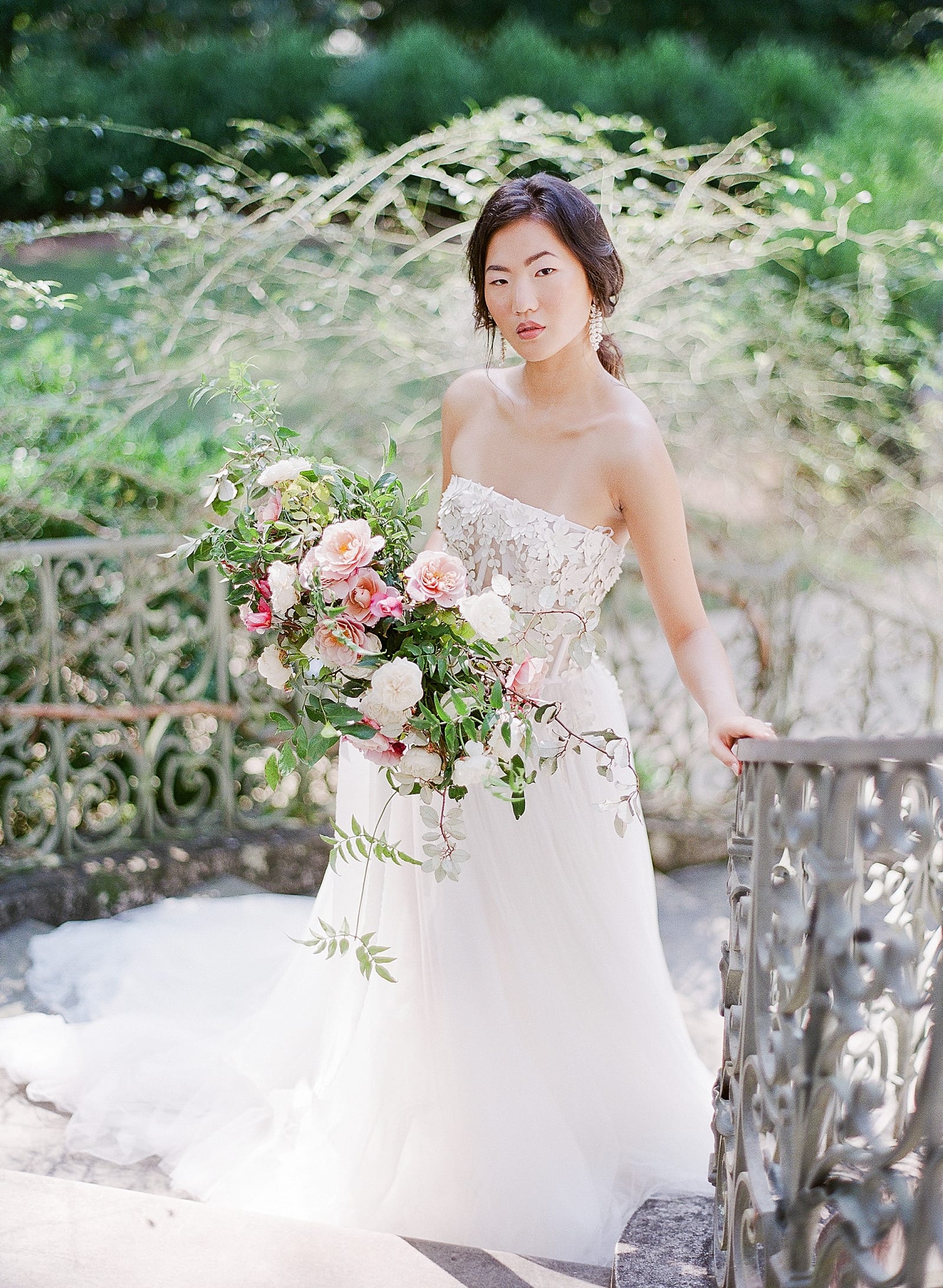 Bride with bouquet on stairs  Photo