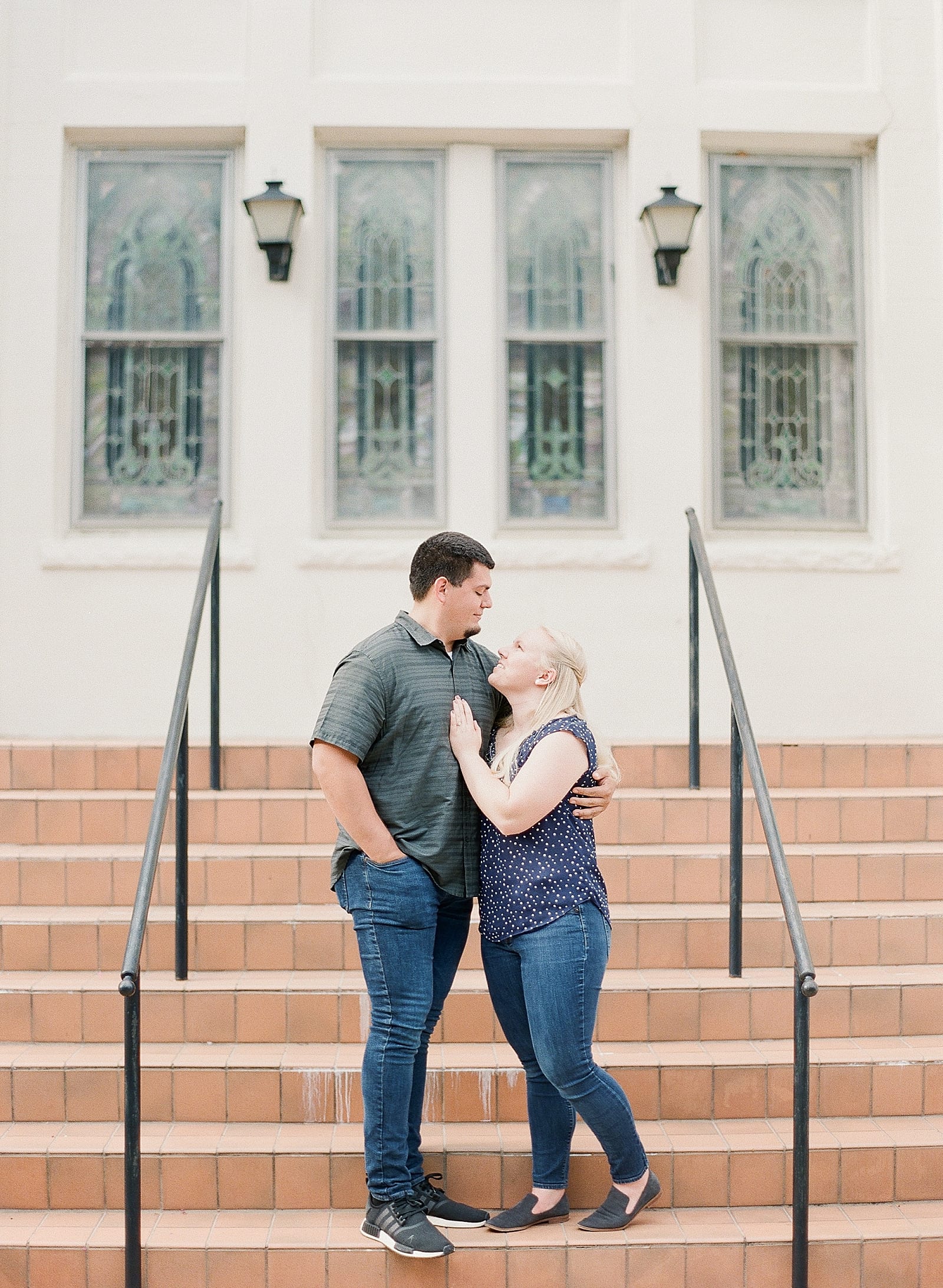 Downtown Raleigh NC Couple snuggling on stairs photo