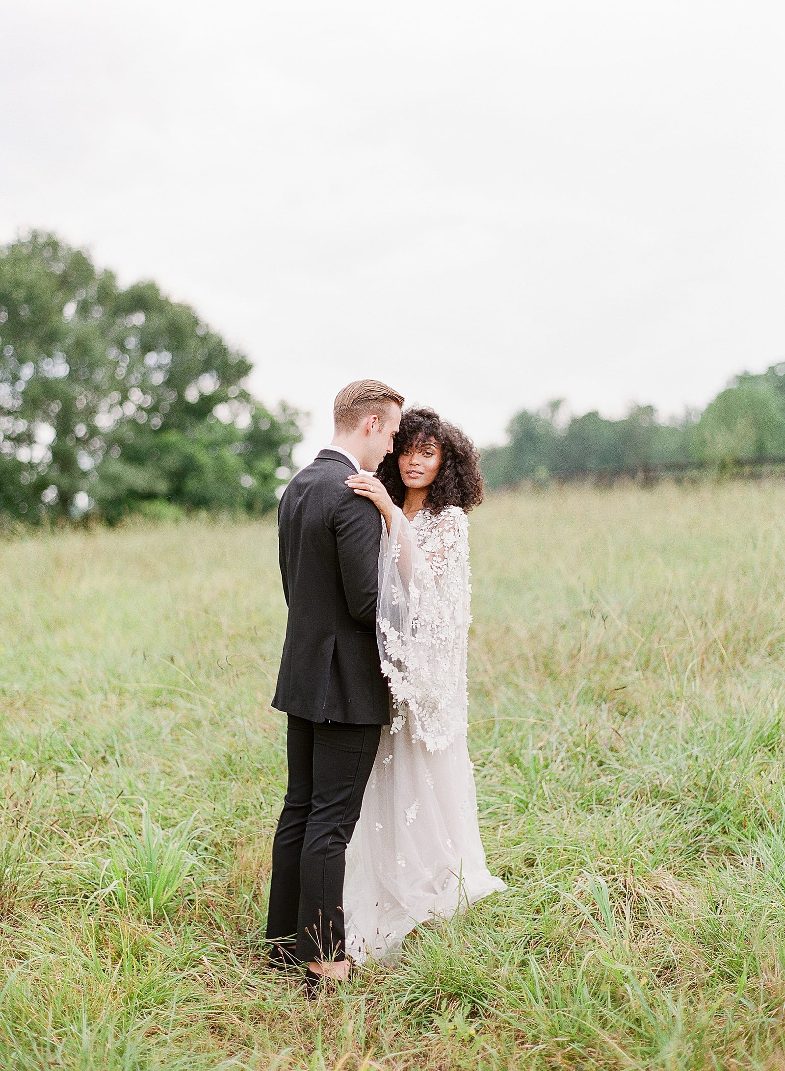 Bride and Groom In field at Inn at Serenbe Photo
