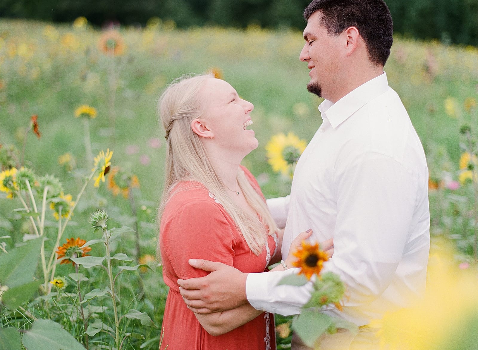Couple Laughing in Field Photo