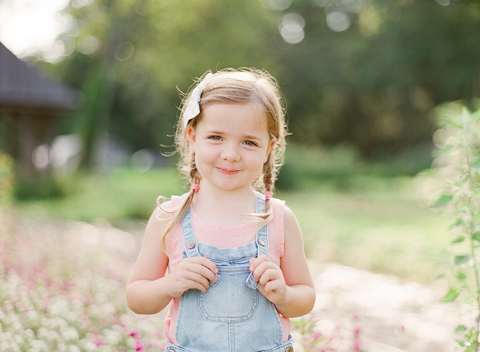 Little Girl With a Sweet Smile in Overalls Photo