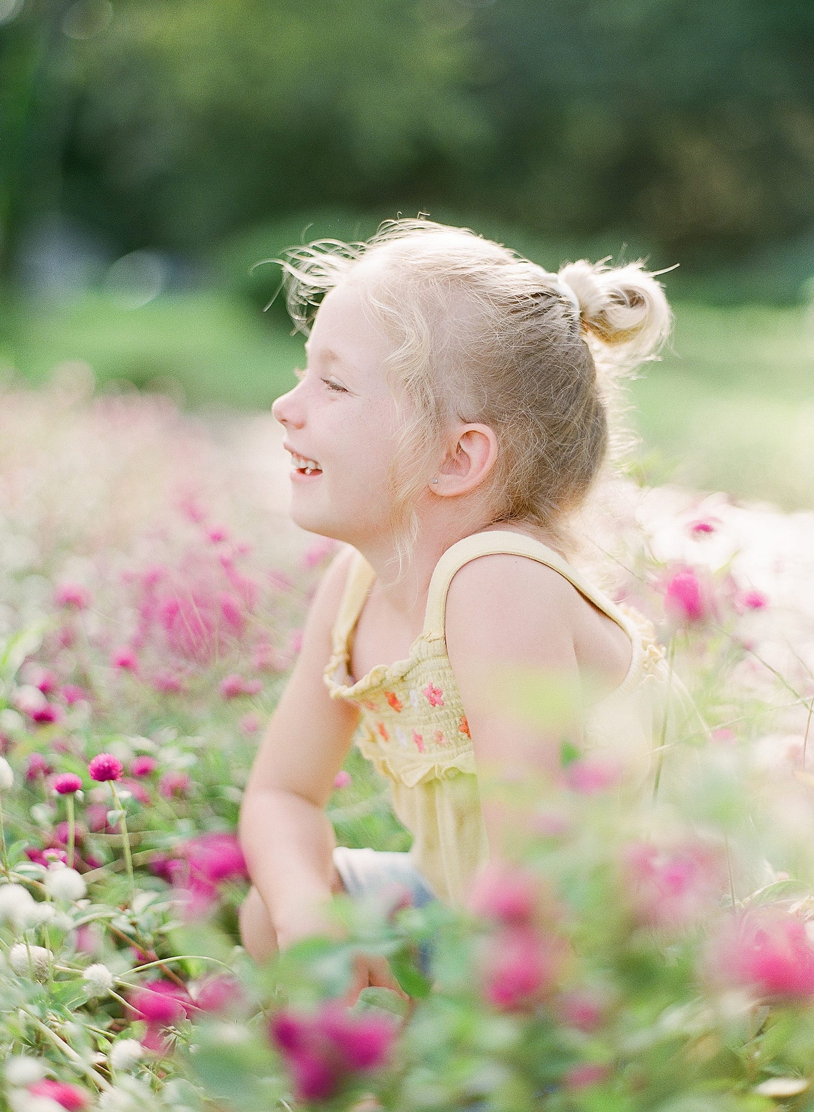 Little girl in Purple Flowers Smiling Photo