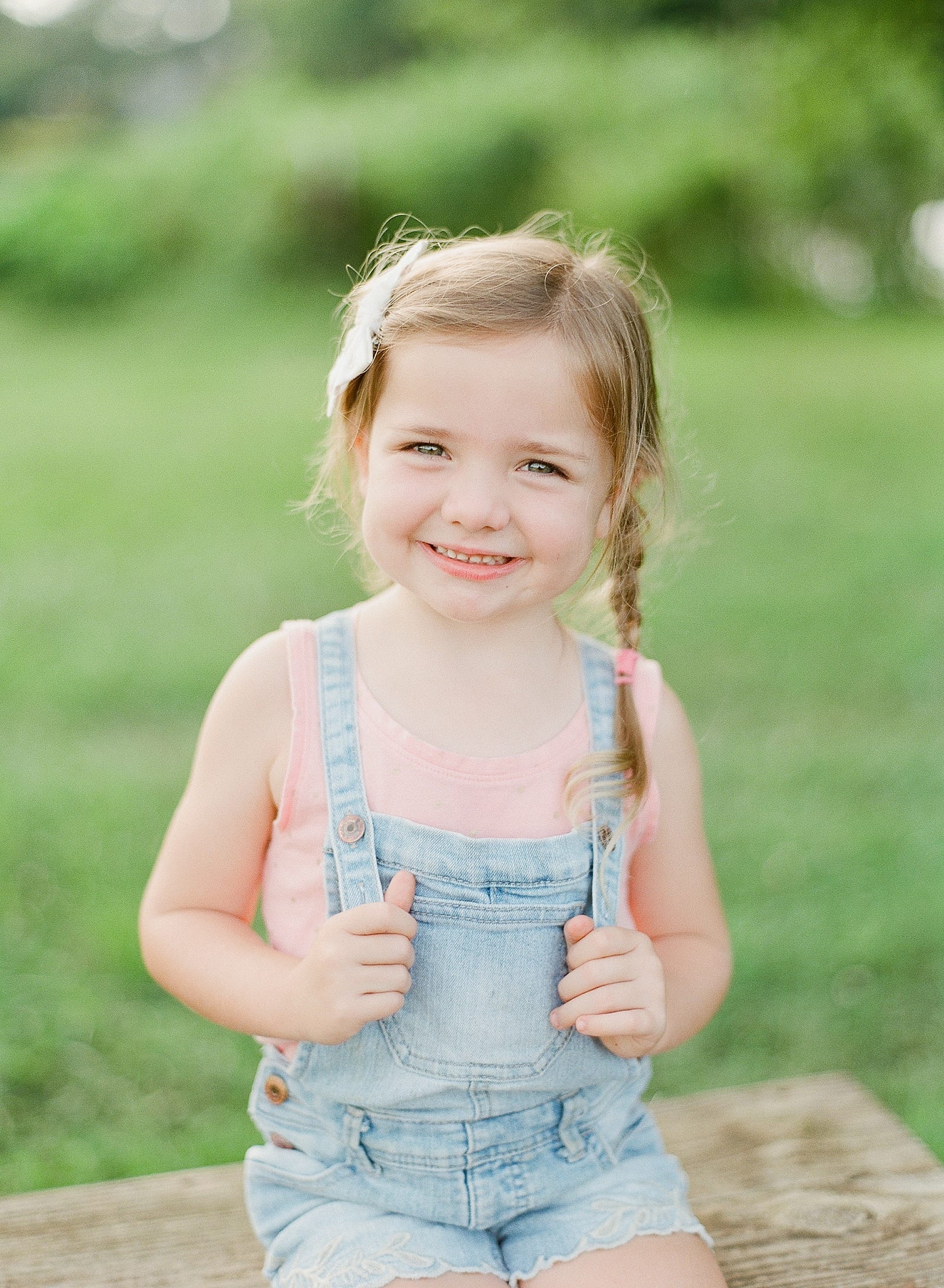 Photographing Children Little Girl Smiling in Overalls Photo