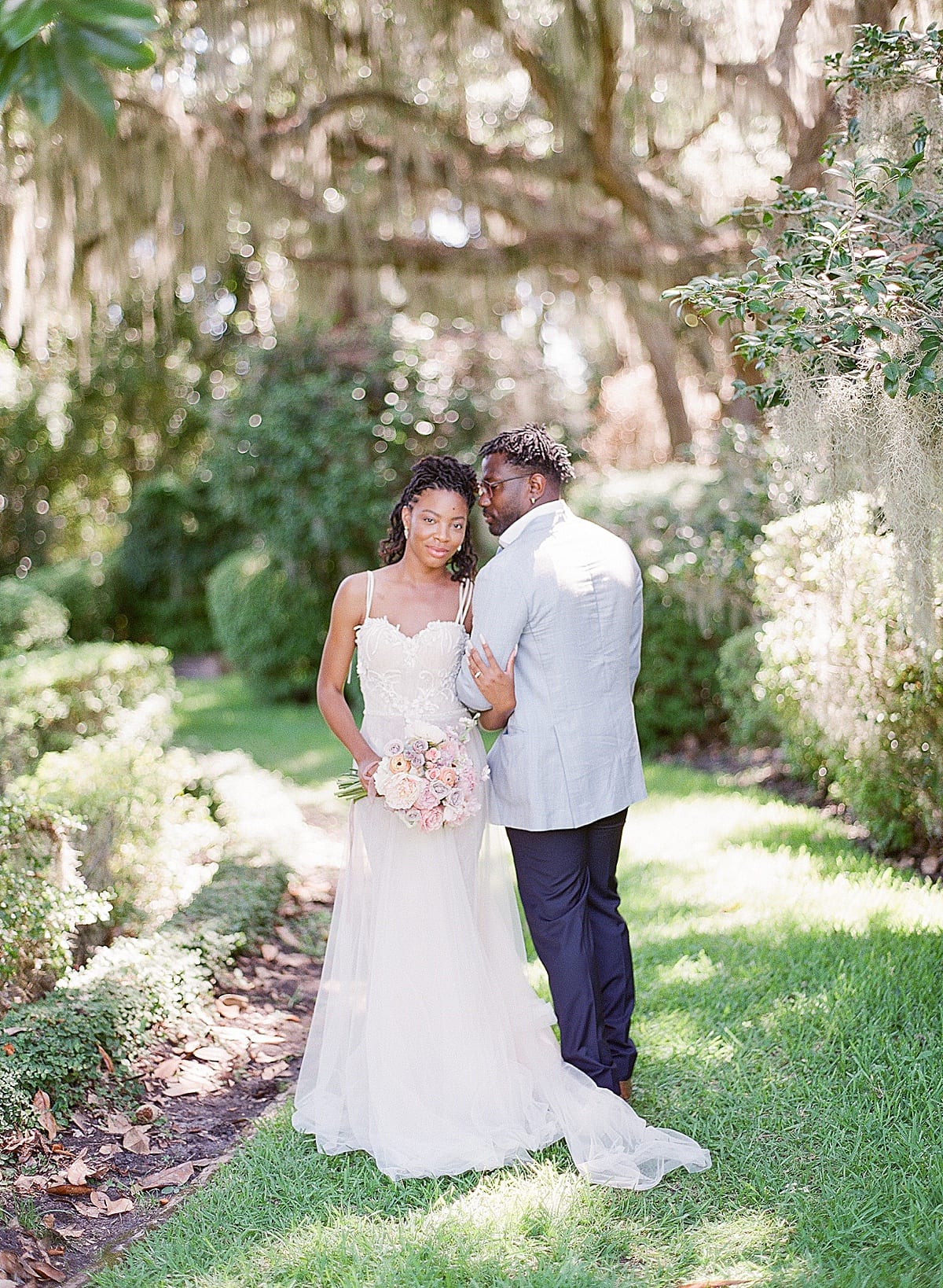 Sea Island Wedding at Musgrove Retreat Bride and Groom Under Spanish Moss Covered Trees Photo 