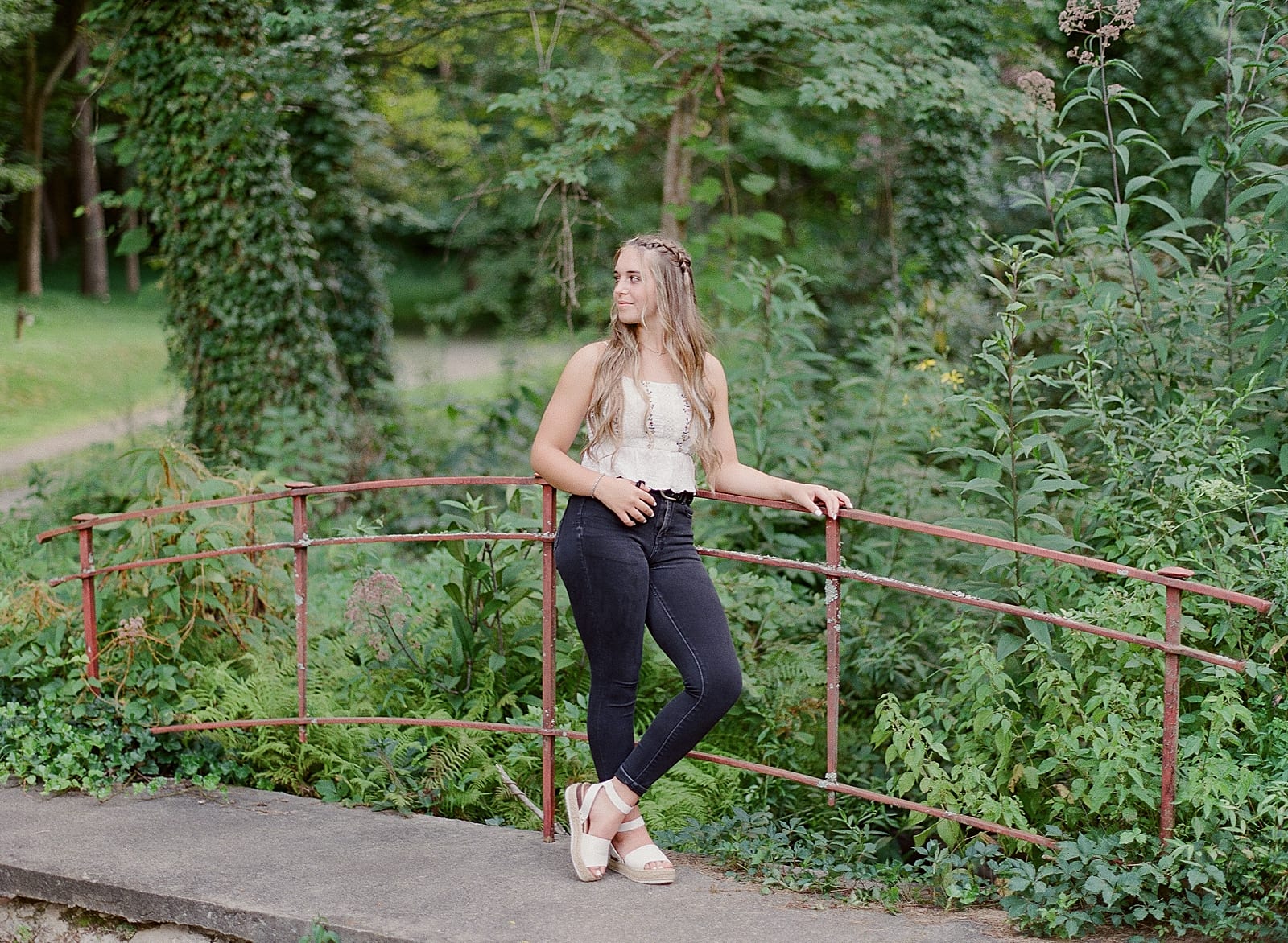 Senior Photos Girl Looking Off Leaning On Rail Photo