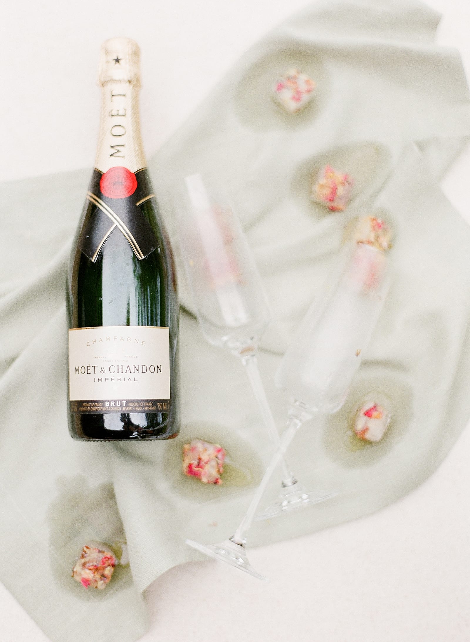 Champagne with Glasses and Ice Cubes with Flowers Photo