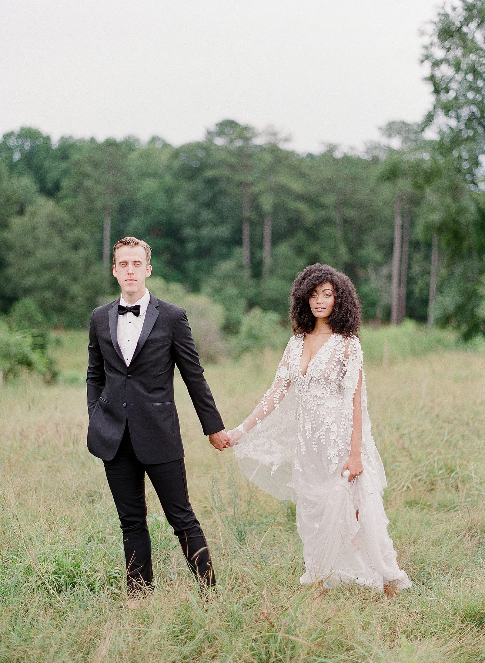 Bride and Groom Holding Hands Looking at Camera at Serenbe GA Photo