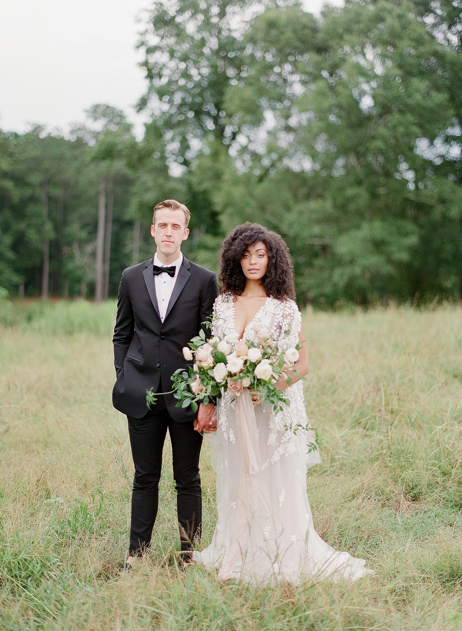 Bride and Groom Holding Hands in Field at Serenbe GA Photo