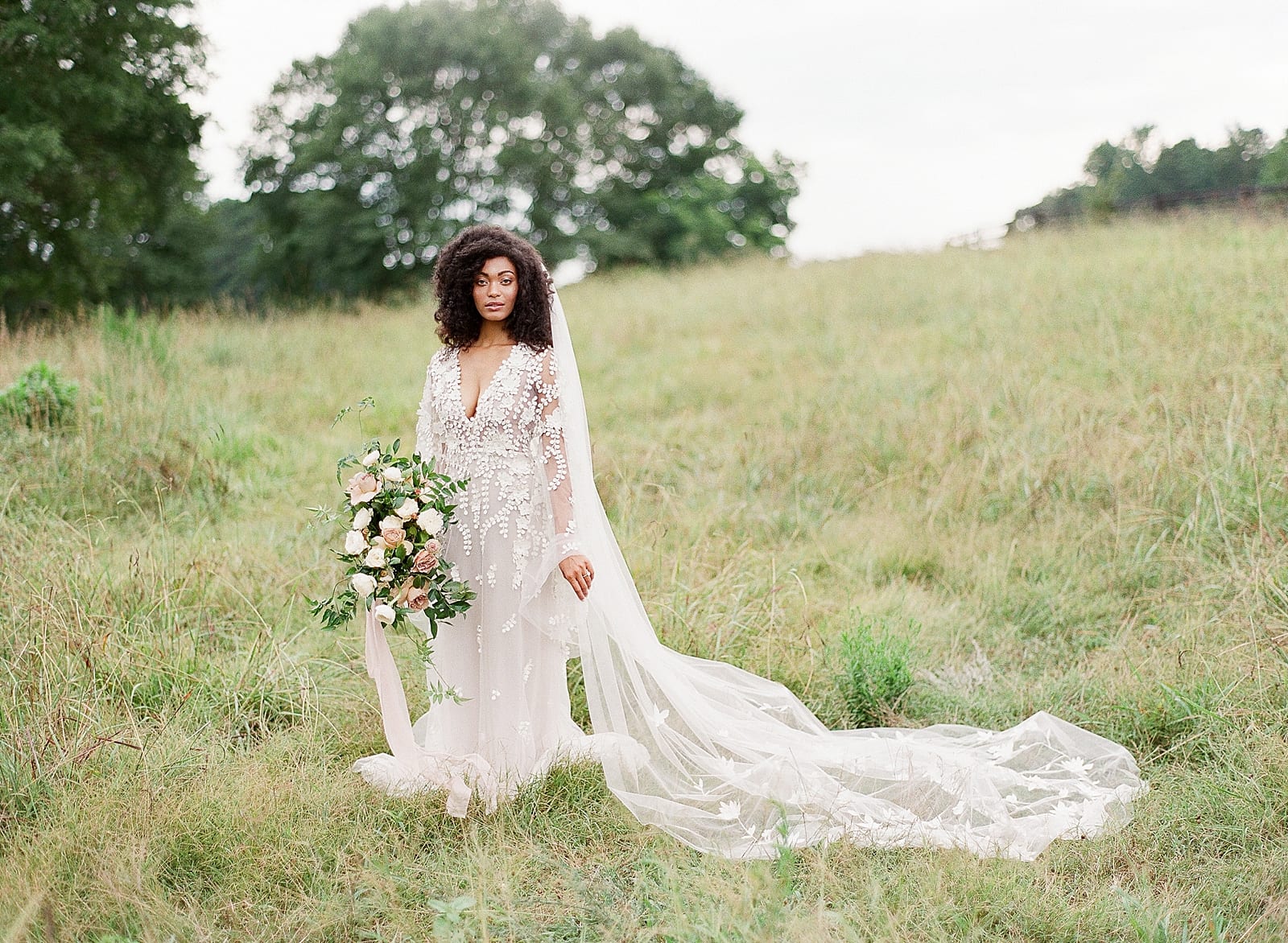 Bride with Bouquet and Cathedral Veil in Field in Serenbe GA Photo