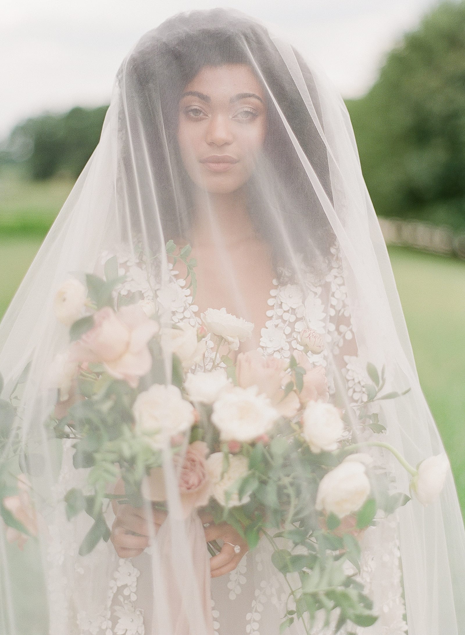 Bride Hold Bouquet with Veil Over head Photo