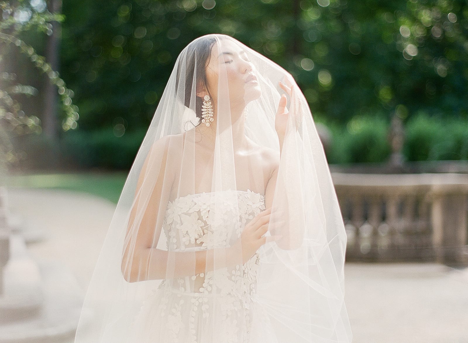 Swan House Atlanta Bride under veil in Sunlight Photo