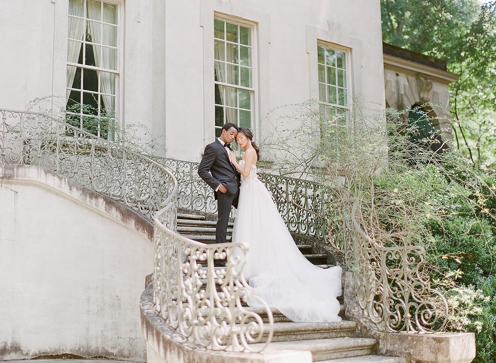 Bride and Groom On Back Stairs of Swan House In Atlanta Photo