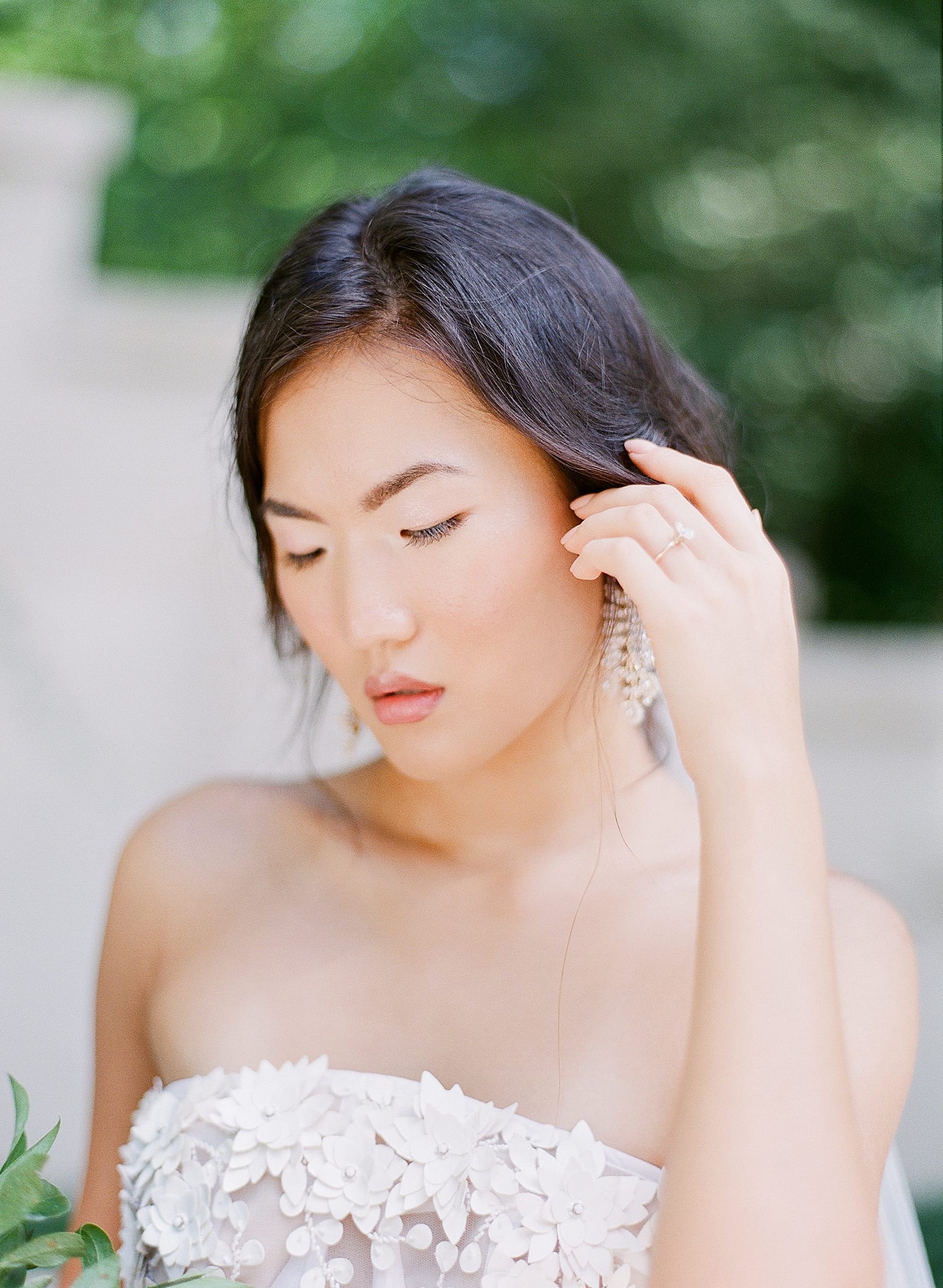 Bride Tucking Her Hair Behind Her Ear Photo