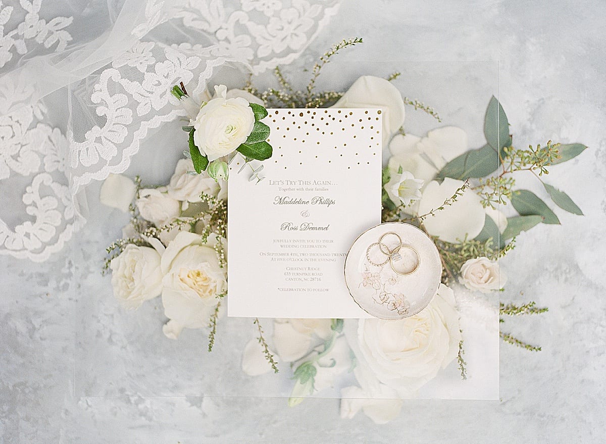 Wedding Invitation with Rings and Flowers Photo