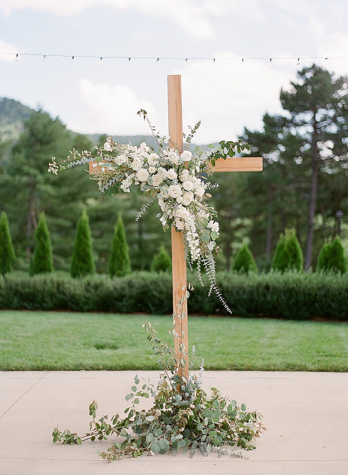 Wedding Ceremony Cross with Flowers Photo