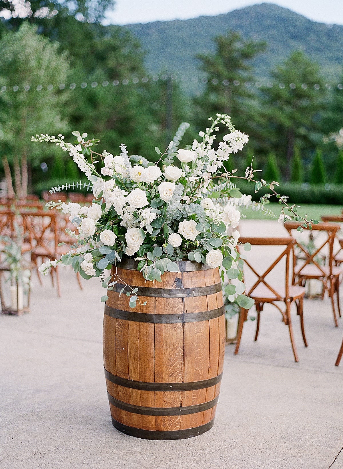 White Wedding Flowers on Whiskey Barrel Photo