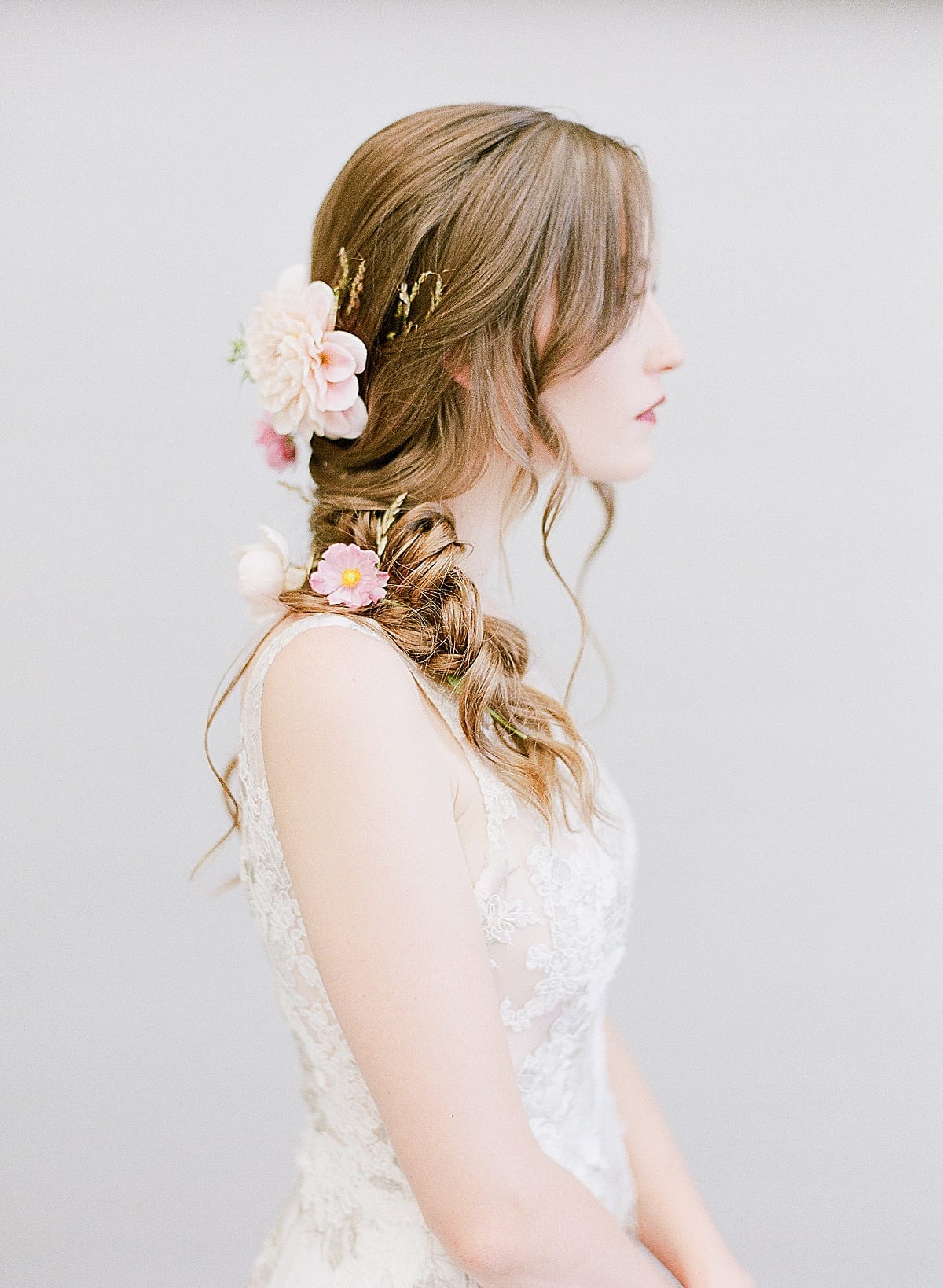 Wedding Hair and Makeup Bride's Hair Braided with Flowers Photo