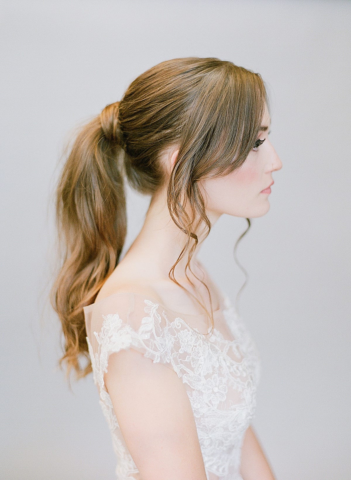 Bride in Front of Grey Background with Ponytail Photo