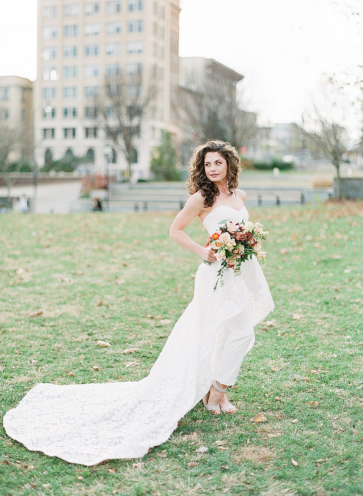 Bride Looking Off Holding Bouquet in Park Photo