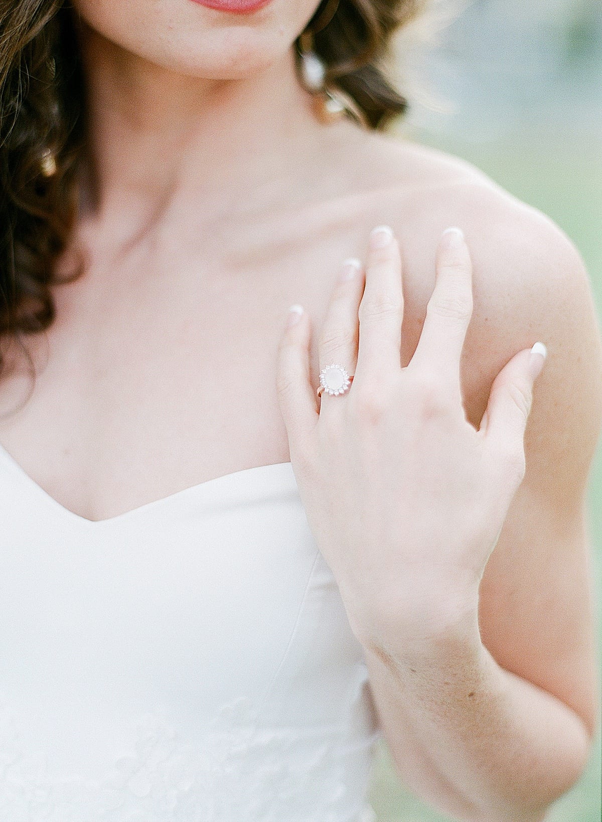 Brides Ring Hand on Shoulder Detail Photo