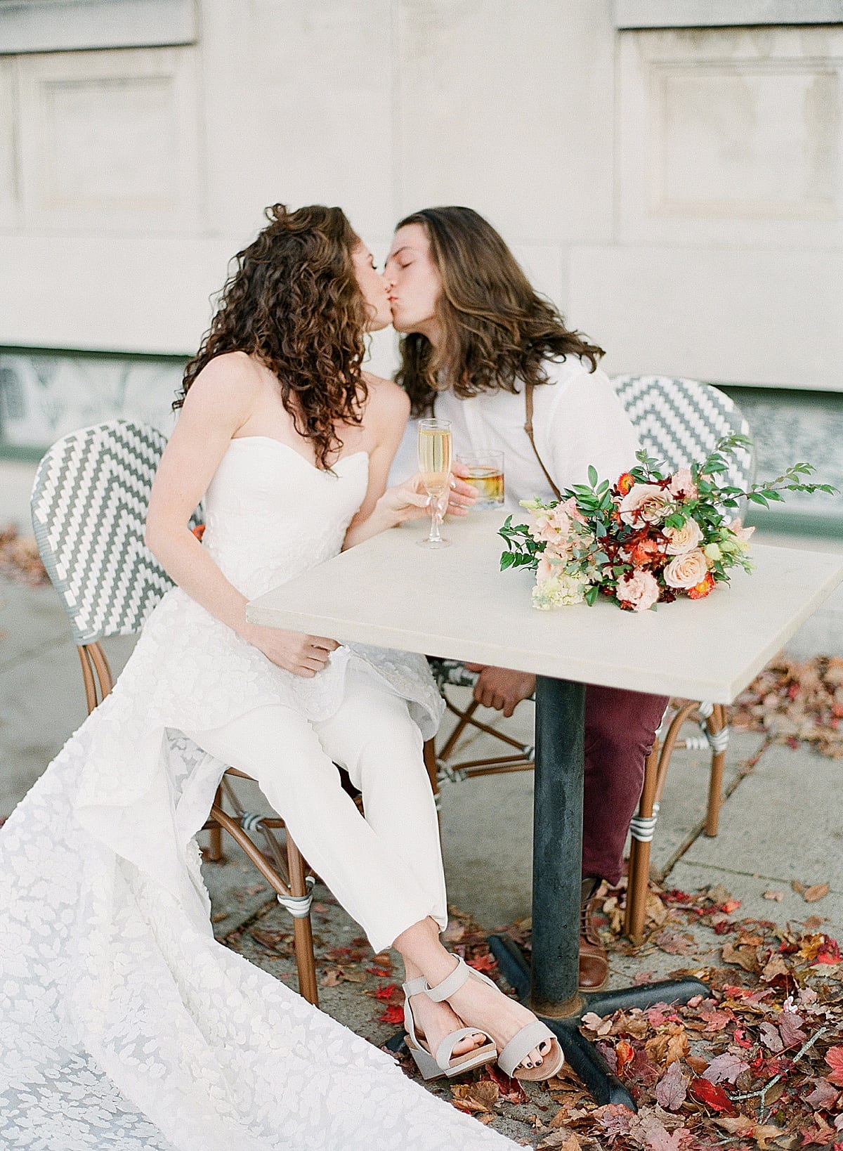 Asheville Elopement Couple Kissing Over Drinks Photo