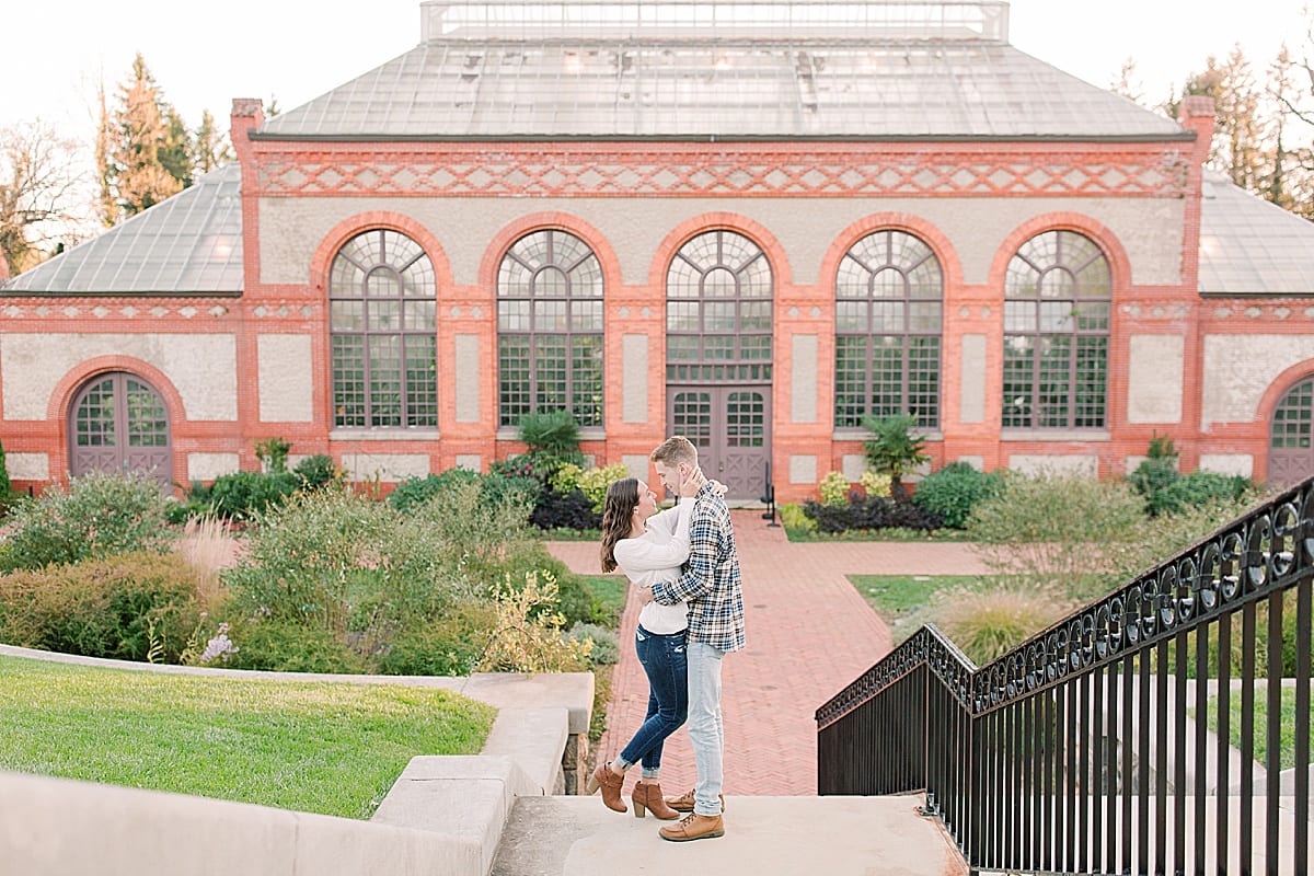 Couple on Steps Hugging in front of Biltmore Conservatory Photo