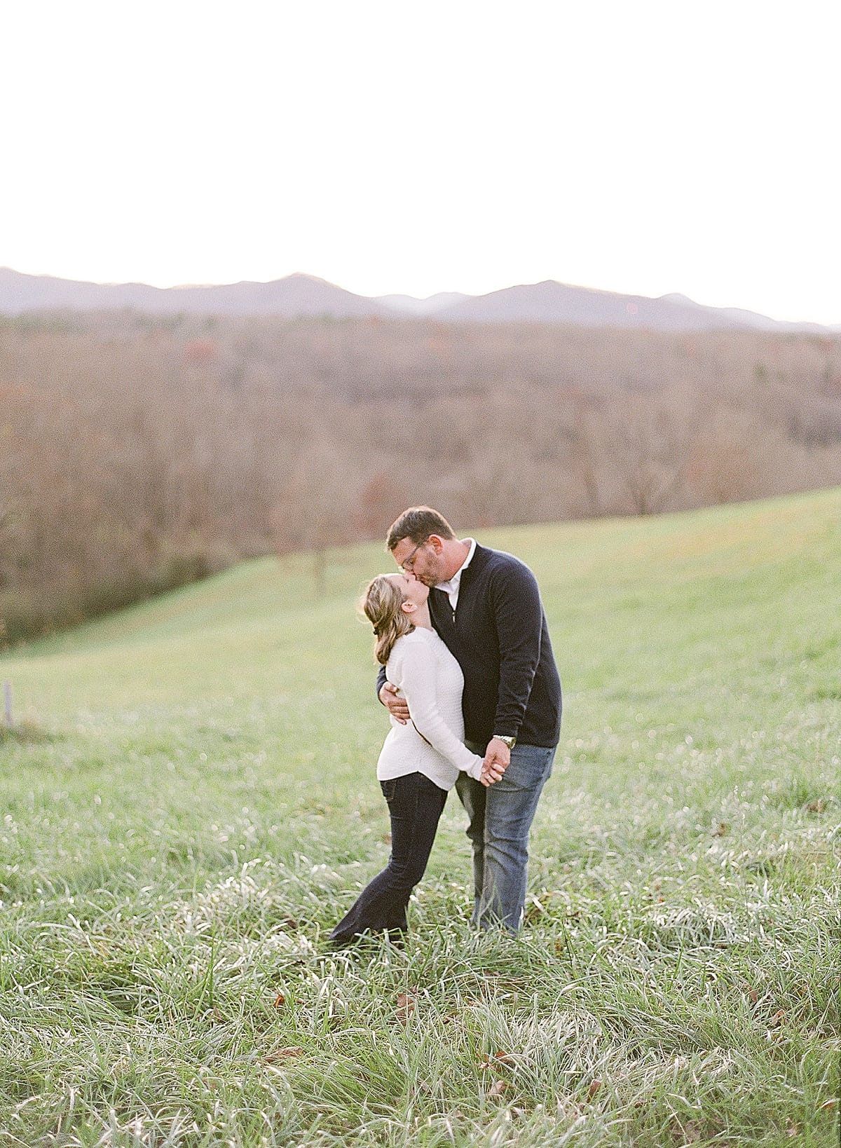 Couple Kissing in Field Photo